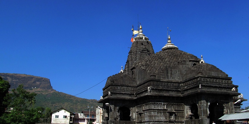 An image of the ancient Trimbakeshwar temple resembles a colony of bees at dusk.