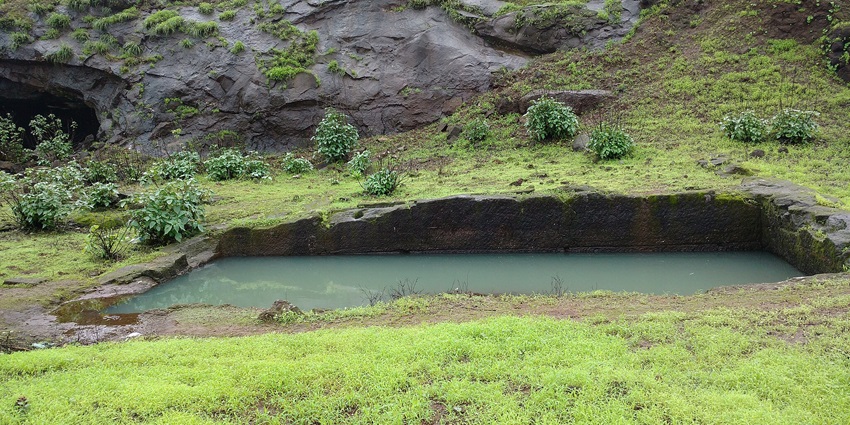 The beautiful picture of the rock-cut water cistern in Tringalwadi Fort, Maharashtra.