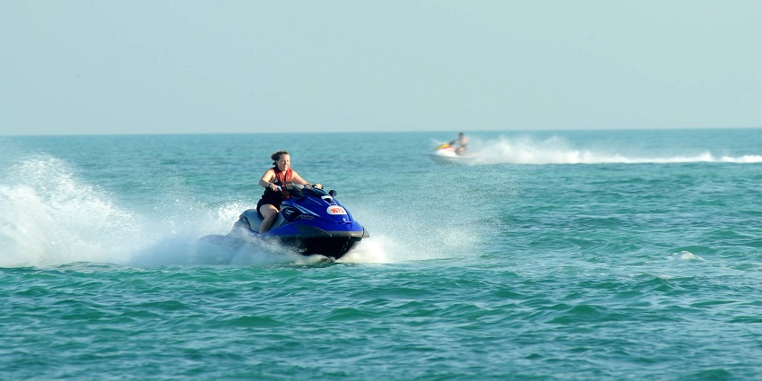 A tourist jet skiing through the clear waters, one of the most thrilling things to do in Diveagar