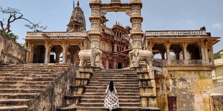 Woman posing on stairs ancient temples in Pune during day time view