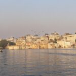 A serene and simple view of Lake Pichola in Udaipur, showcasing its spiritual heritage of Udaipur Temples.