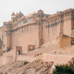 A panoramic view of a fort in India, with its massive stone walls and circular bastions.