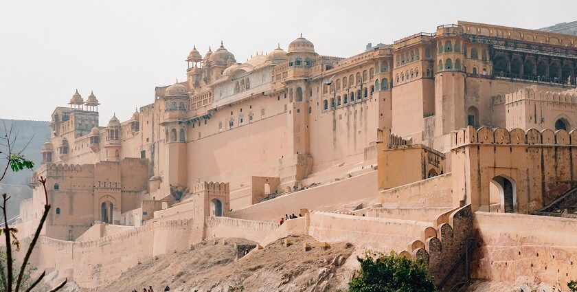 A panoramic view of a fort in India, with its massive stone walls and circular bastions.