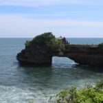 An image showing Uluwatu Temple in Bali situated on a dramatic cliffside