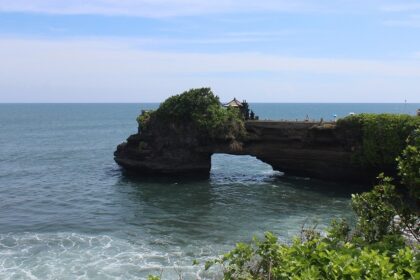 An image showing Uluwatu Temple in Bali situated on a dramatic cliffside