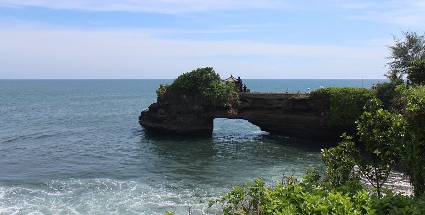 An image showing Uluwatu Temple in Bali situated on a dramatic cliffside