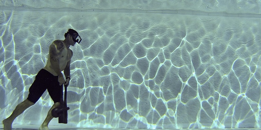 Experience underwater walking, exploring marine life while wearing a helmet.