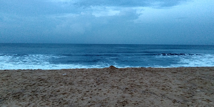 A picture of the scenic Maravanthe Beach in Honnavar with blue hues all around