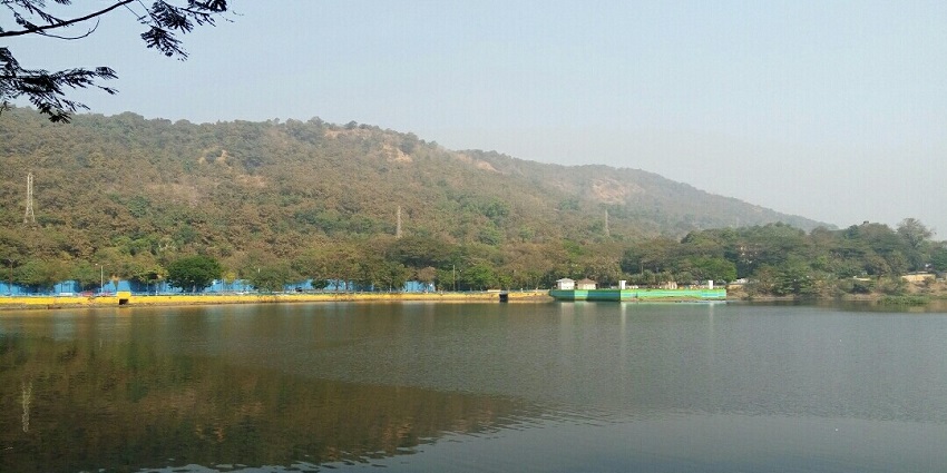 Serene view of Upvan Lake with illuminated surroundings, one of the best places near Funland Water Park