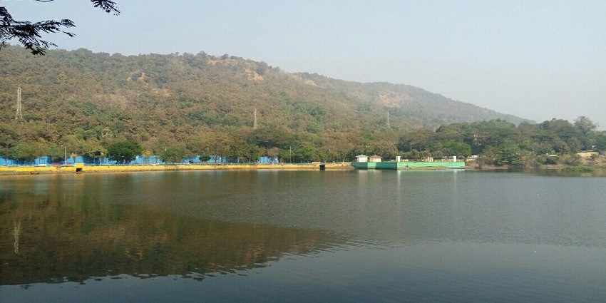 Scenic view of Upvan Lake in Thane, surrounded by greenery and mountains