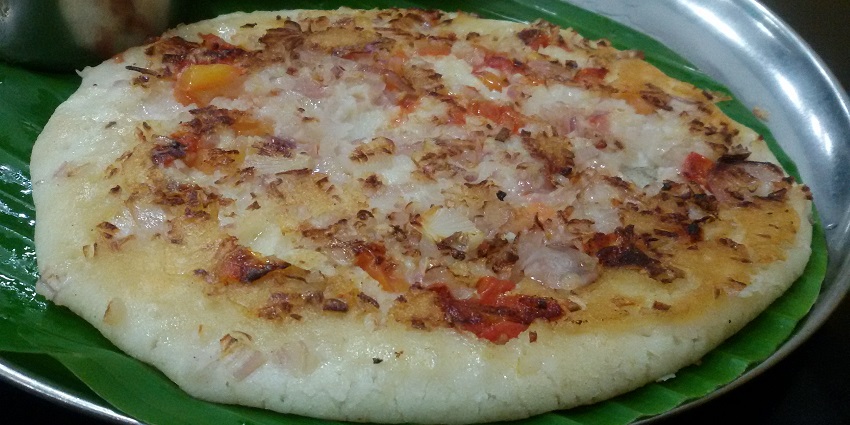 Thick, savoury pancake topped with vegetables and served with chutney.