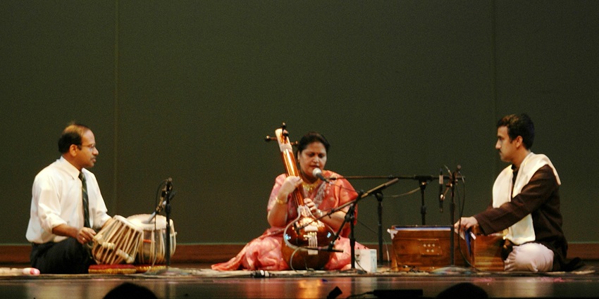 An image of musicians performing Indian classical music at the Vadodara Classical Music Festival.