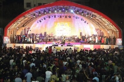 An image of a vibrant music festival in Vadodara with crowds enjoying live performances.