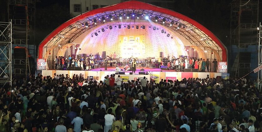 An image of a vibrant music festival in Vadodara with crowds enjoying live performances.