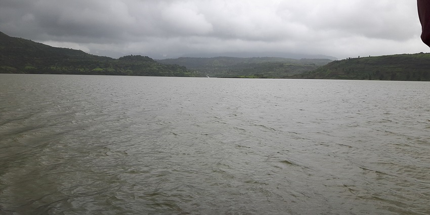 An image showing Vaitarna Dam with lush greenery during the rainy season.