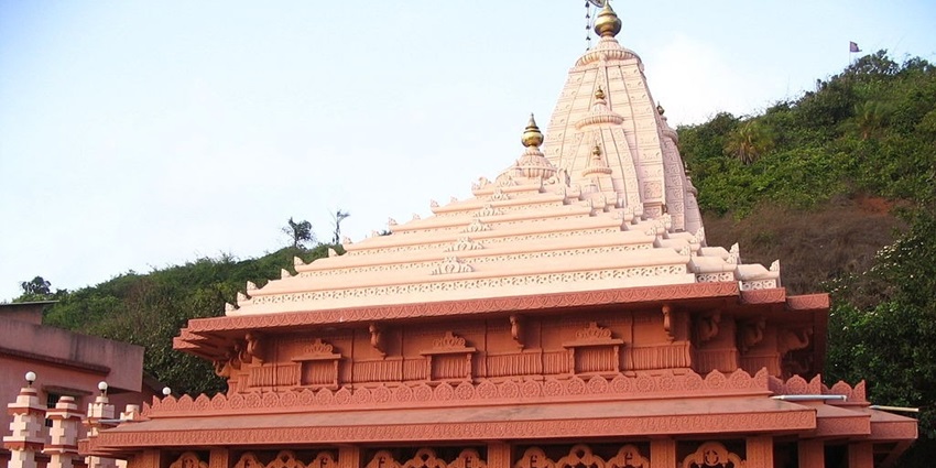 The temple is located on the banks of a river and has several hot springs around it