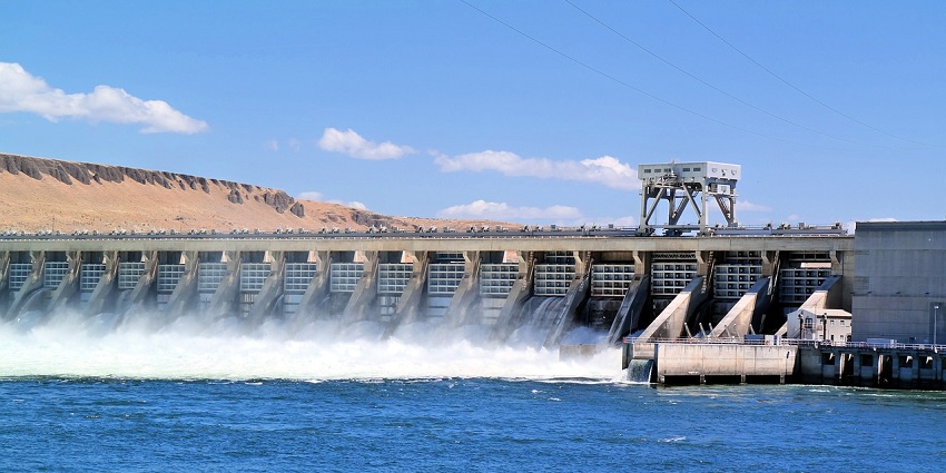 Panoramic view of a large dam with a flowing river, one of the popular place near Panshet Water Park.