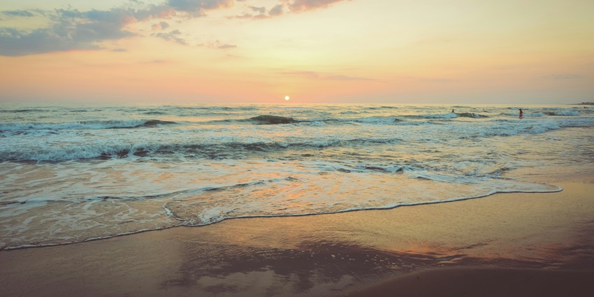 Beautiful sunset over Vasai beaches, with golden skies reflecting on the calm waters