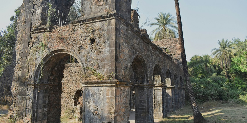 An image of the ancient Vasai Fort showing ancient architecture with massive walls.