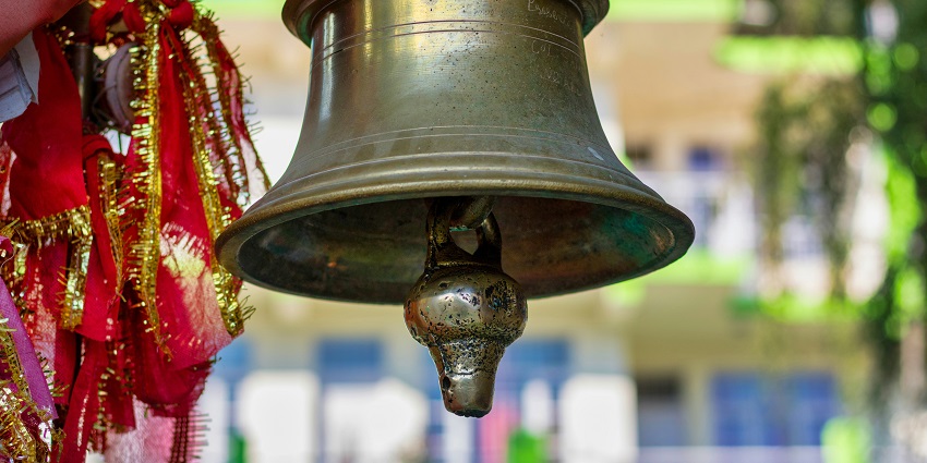 A picture of a temple bell at a serene temple, showcasing the best places to explore.