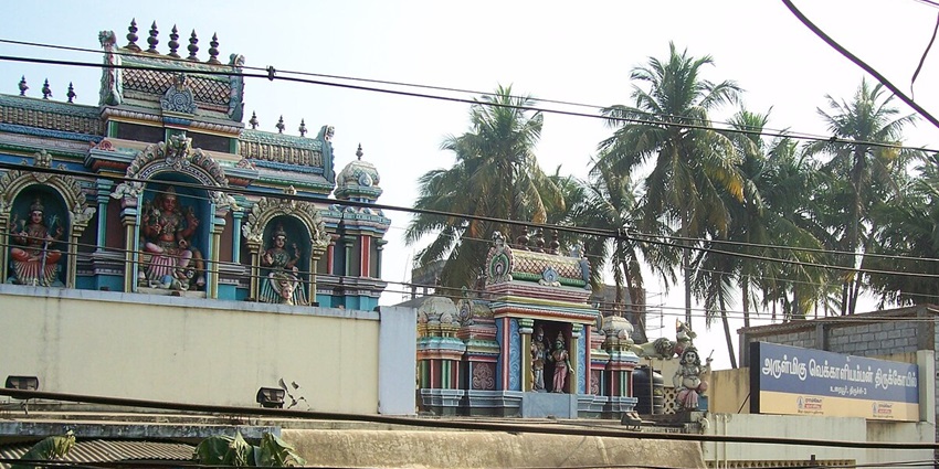 South entrance of the traditional Vekkali Amman Temple with ornate pillars and steps.