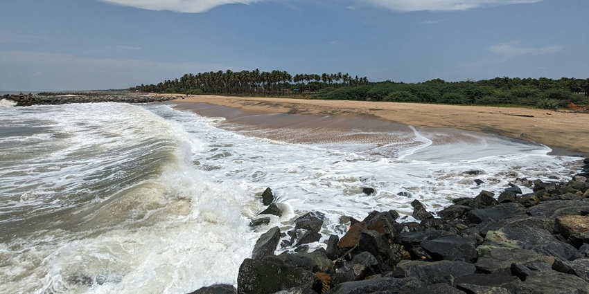 Scenic view of the Velas beach with waves crashing the sandy shores