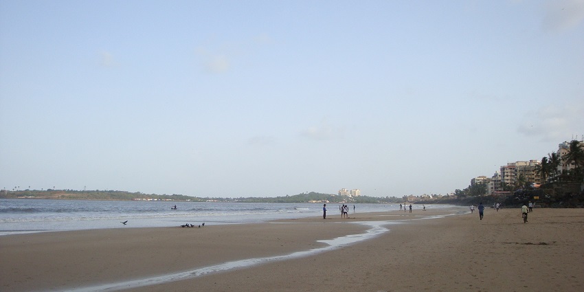 Picturesque Versova Beach with golden sands and vibrant waves, perfect for relaxation.