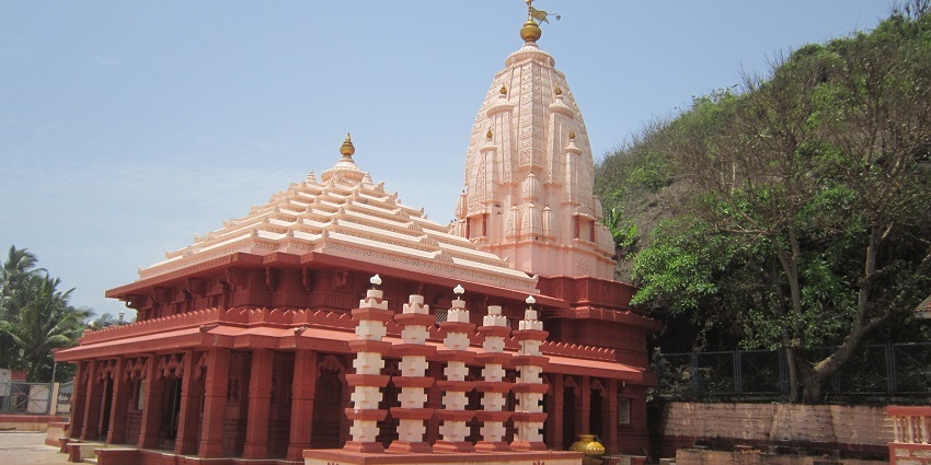 An ancient temple with colourful sculptures and elaborate architecture.