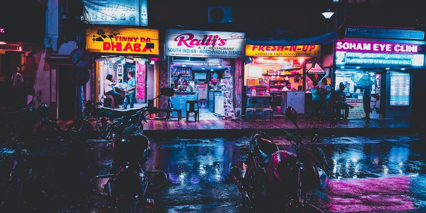 A photograph of a street selling famous food items with rich taste.
