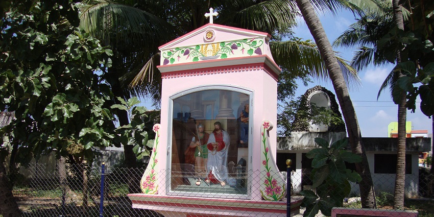 St. Lourdes Church, showcasing its distinct architecture and surrounding greenery.