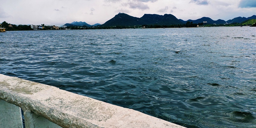Enjoy boating on Fateh Sagar Lake, surrounded by scenic views and lush hills in Udaipur.