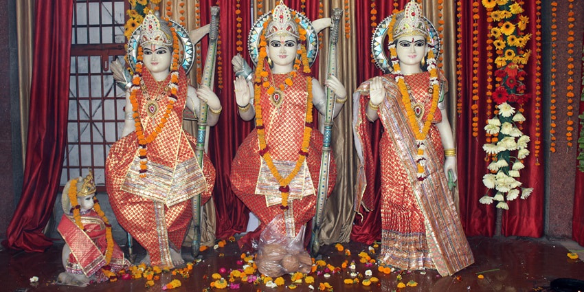 The main prayer sanctum of a temple with the idols of Lord Rama, Goddess Sita, and Lord Lakshman