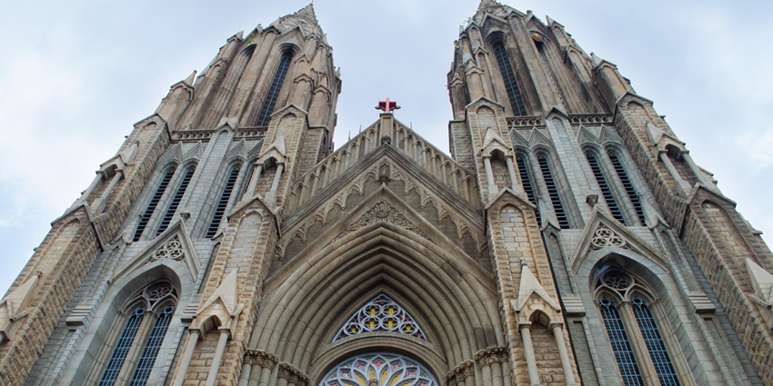 Admire the stunning Gothic architecture of St. Philomena's Church from its grand front view.