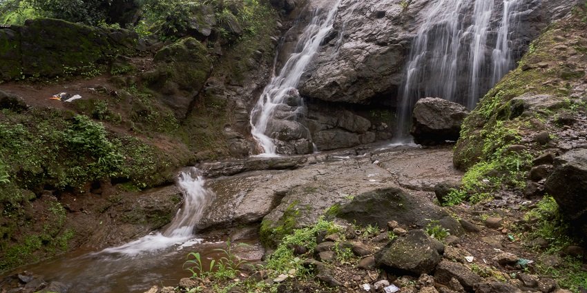 The waterfalls cascading through lush greenery - one of the things to do in Bhimashankar.