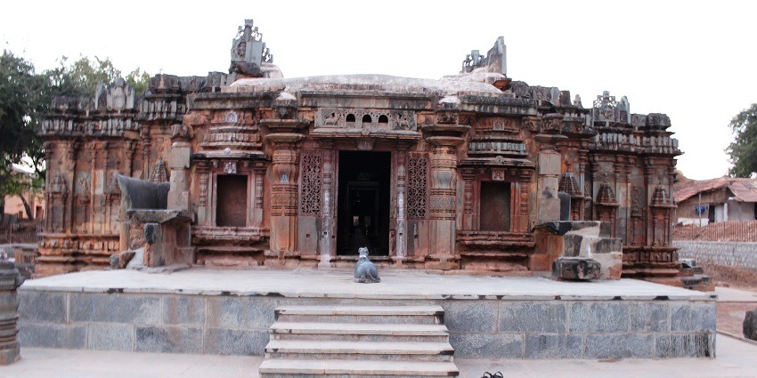 A view of the Ancient stone Chandramouleshwar Temple with intricate carvings and pillars.