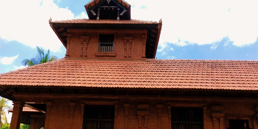 A traditional Chawadi building in Shirdi featuring a simple architecture with a sloping roof