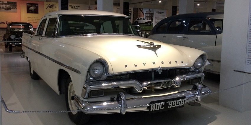 A picture of a black vintage car at the Gedee Museum, showcasing rare automobile collections.