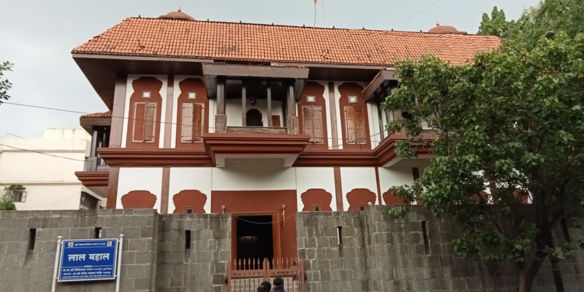 Lal Mahal in Pune, a red palace with arched windows and Maratha architecture.