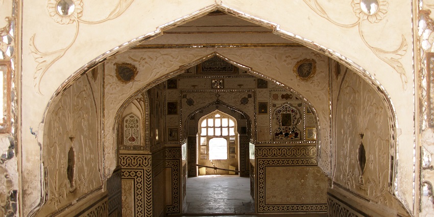 A painting depicting Krishna and Rukmini from the Sheesh Mahal is a serene highlight.