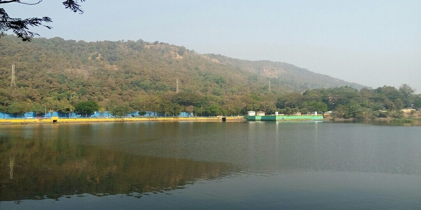 Serene view of Upvan Lake with surrounding greenery, one of the best things to see in Thane.