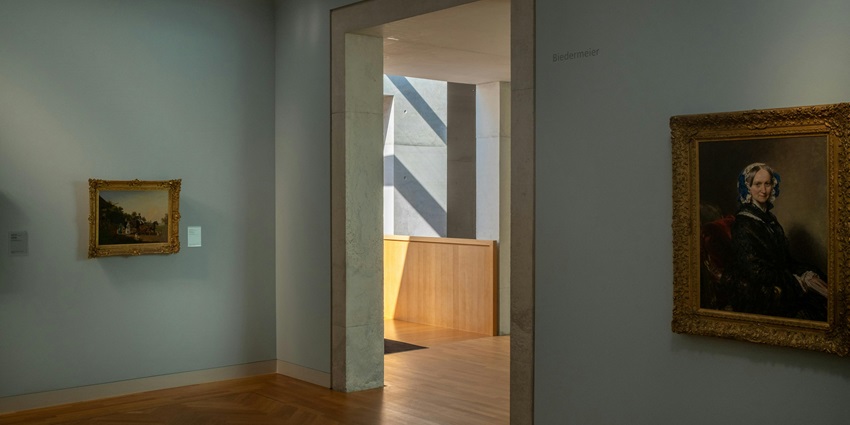 Image of a museum with painting and portraits on the wall - explore this Triveni Museum