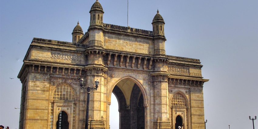 Gateway of India monument in Mumbai with detailed stone arches and plaza view.