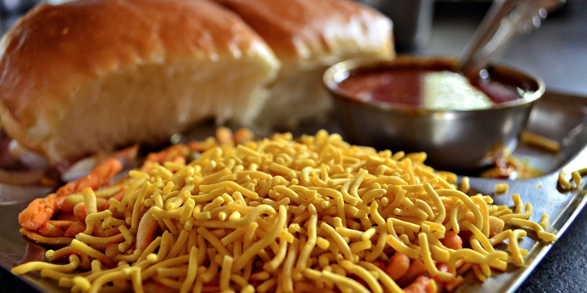 A steaming plate of misal pav garnished served at this restaurant in Solapur