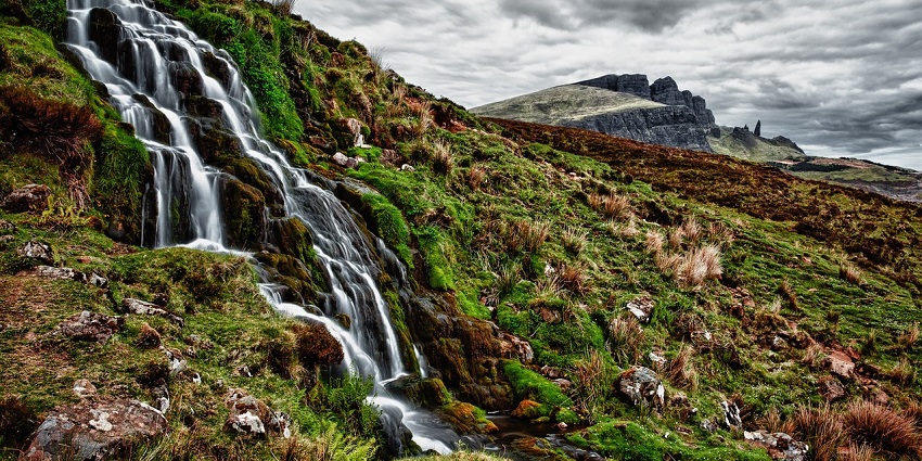 Captivating view of Waghora Waterfalls surrounded by dense forest and rocky cliffs