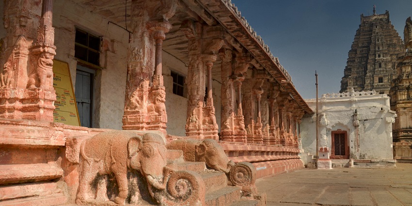 Participate in the unique ritual of throwing gulal held inside the temple