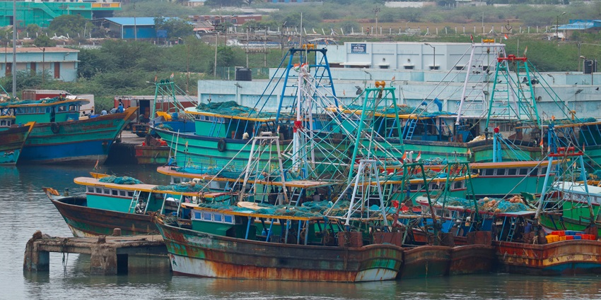 Aerial view of Karaikal Port showcasing large cargo ships docked at the terminal