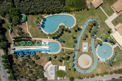 An aerial view of a famous adventure hub in Maharashtra featuring colourful rides.