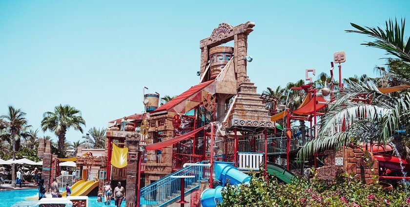 A view of a colourful ride surrounded by serene waters at the leisure hub in Maharashtra.