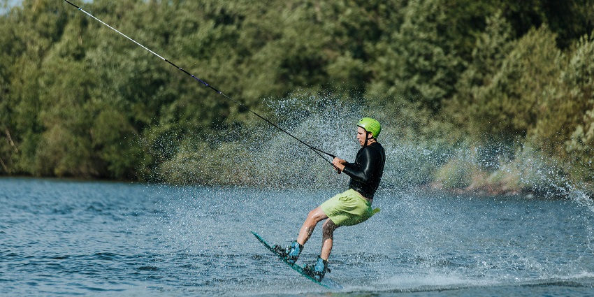 An image of a water skier who can be seen gliding over the surface of Khadakwasla Lake.