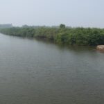 View of calm water in Malgund Creek in Ganpatipule.